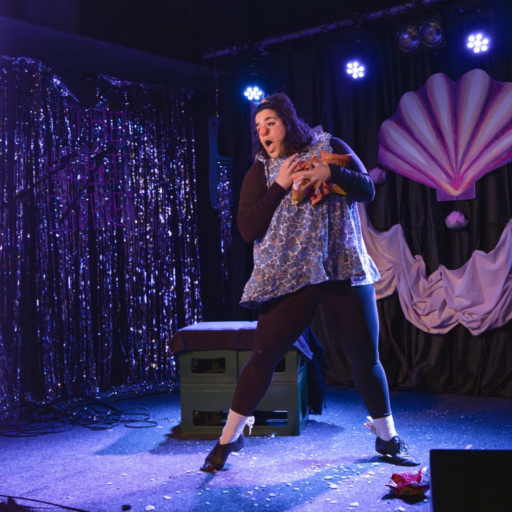 Ruthie performing on a cabaret stage